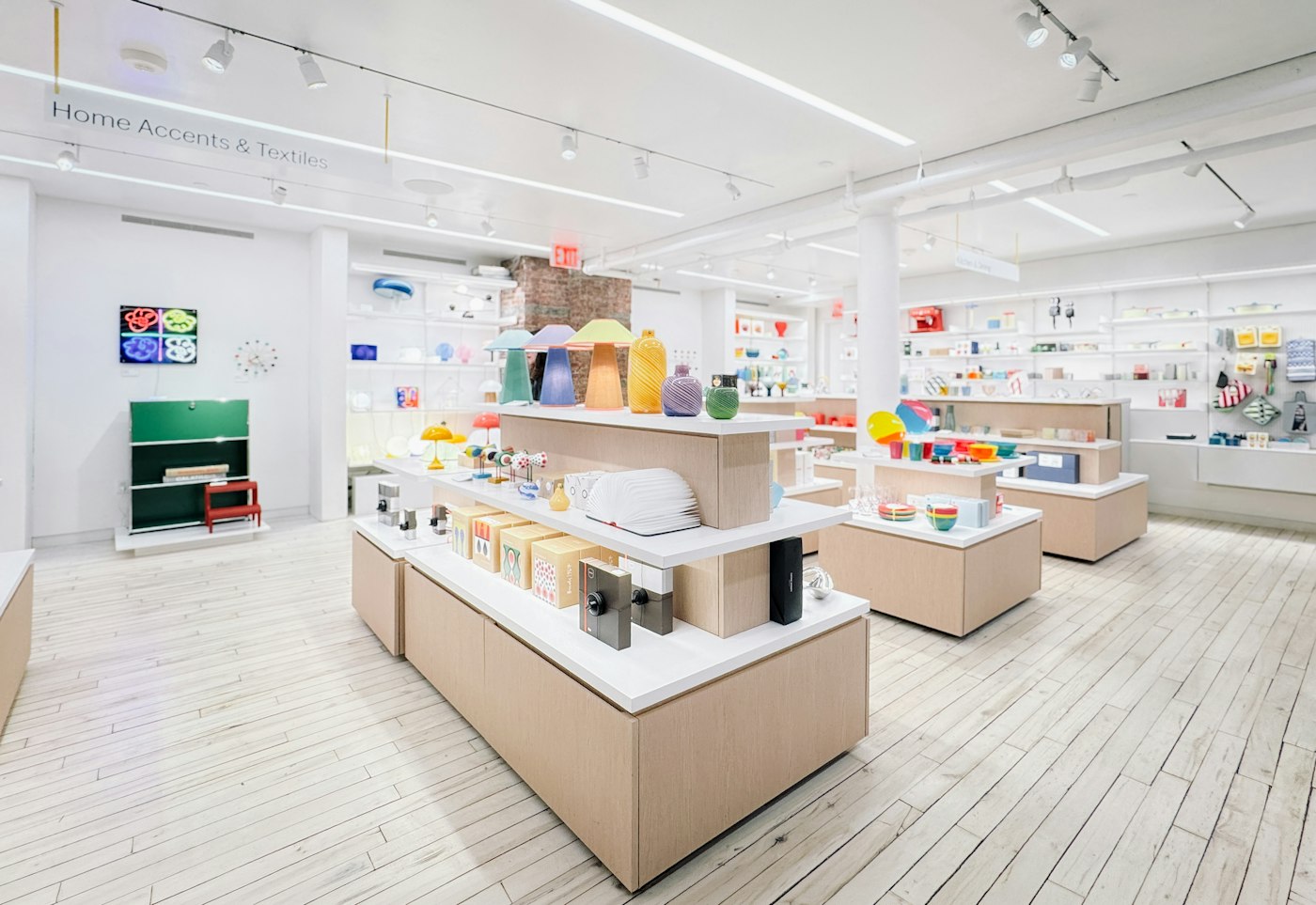 A bright, modern retail store interior with products on display tables